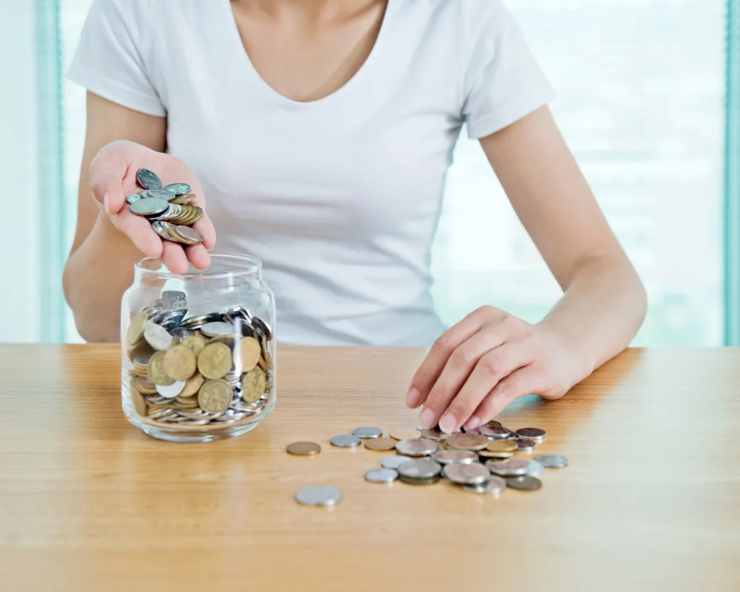 Watching savings goal progress grow in a jar